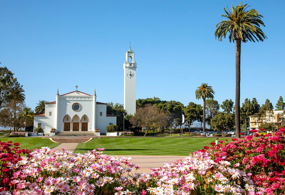 Sacred Heart Chapel in the distance with flower garden in the foreground